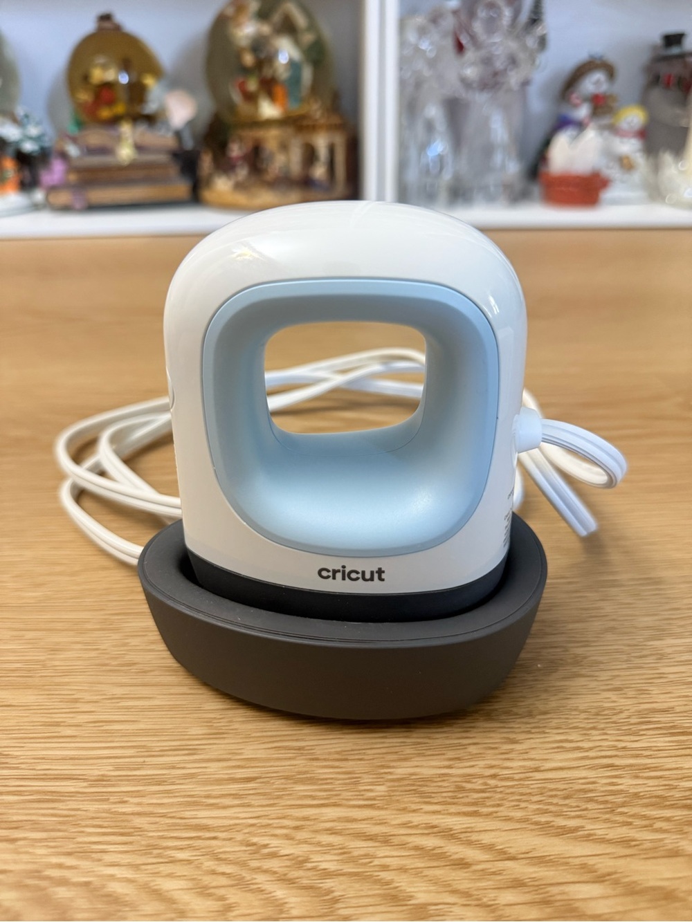 Cricut Mini Handheld Iron in White and Light Blue with Dark Gray Base